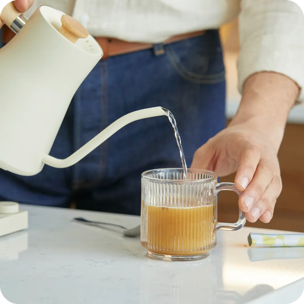 Preparing a Unimate drink with hot water